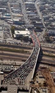Aerial view of vehicles waiting to cross the U.S./Mexico border.